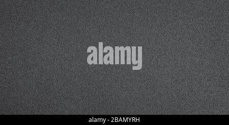 Long black metallic textured plate close up. Texture and background Stock Photo