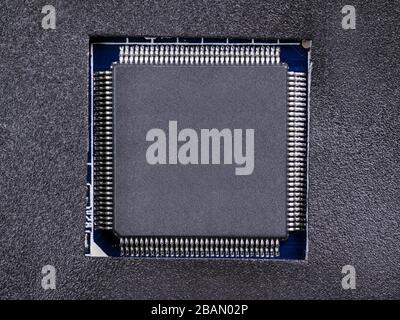 Gray textured electronic circuit close up. Top view, copy space on the circuit Stock Photo