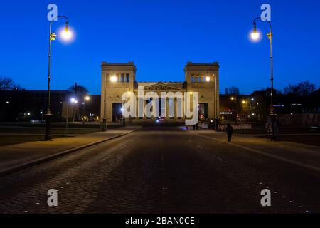 Munich, Germany. 28th Mar, 2020. The Königsplatz in front of the Propyläen is almost deserted. Credit: Sven Hoppe/dpa/Alamy Live News Stock Photo