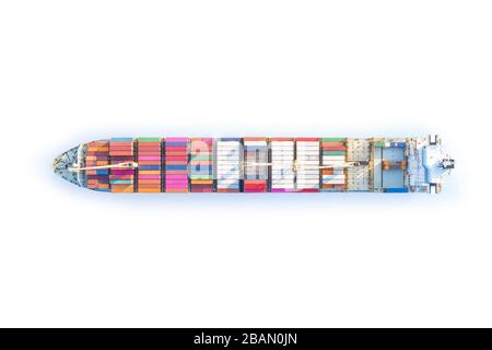 Large full loaded container ship sailing bright blue sea. Top view isolated on white, clipping path included Stock Photo