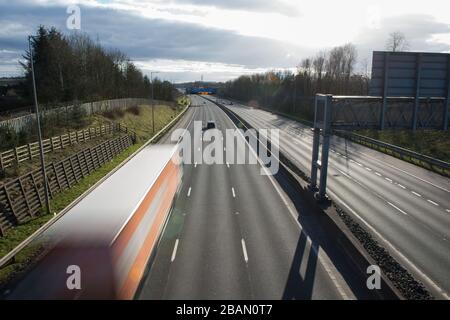 Glasgow, UK. 28th Mar, 2020. Pictured: Road signs all along the M8 and M80 motorways which read, “STAY HOME PROTECT NHS SAVE LIVES” The Coronavirus Pandemic has forced the UK Government to order a shut down of all the UK major cities and make people stay at home, which has left the motorways and all other roads free of the usual nose to tail traffic which would otherwise be there. Credit: Colin Fisher/Alamy Live News Stock Photo