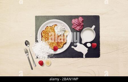 whole wheat waffle for breakfast with squirt cream and ice cream. Waffles, Fruit, Icing, Cream, Ice cream Stock Photo