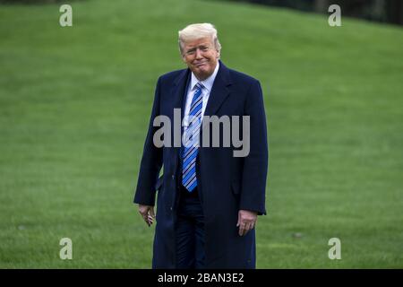 Washington, United States. 28th Mar, 2020. U.S. President Donald Trump walks on the South Lawn of the White House in Washington, DC on Saturday, March 28, 2020. Trump went to Naval Station Norfolk to send off The USNS COMFORT for Deployment to New York City for response to the rapid spread of the coronavirus. Photo by Tasos Katopodis/UPI Credit: UPI/Alamy Live News Stock Photo