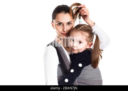 A young mother and toddler girl in woven baby wrap Stock Photo