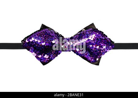 Purple sequins bow tie close up isolated on white background Stock Photo