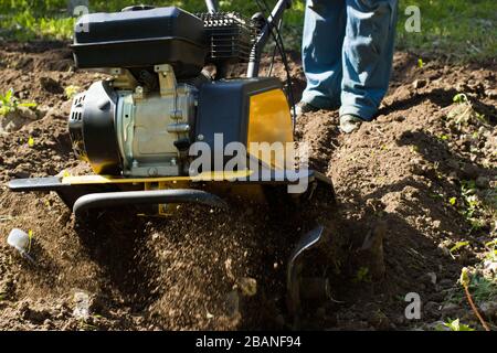 A close up view on working motor cultivator Stock Photo