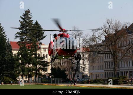 goerlitz GERMANY - march 28 2020: DRF Luftrettung (German Air Rescue) D-HDSW helicopter landing at Wilhelmsplatz. Notarzt means emergency doctor. Stock Photo