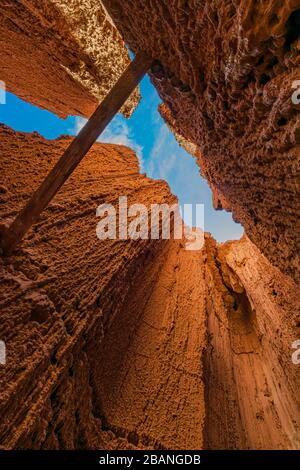 A support beam spans the chasm created by the hoodoos at Cathedral Gorge State Park, Nevada Stock Photo