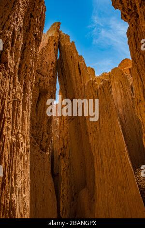 Almost as in prayer, two neighboring clay hoodoos touch each other at Cathedral Gorge State Park, Nevada Stock Photo