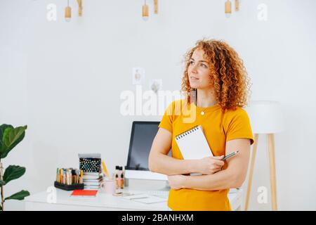 Portrait of thoughtful woman in search of a new idea Stock Photo