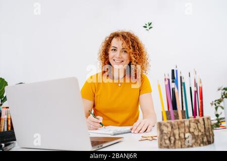 Portrait of a smiling woman. Creative work on a new project Stock Photo