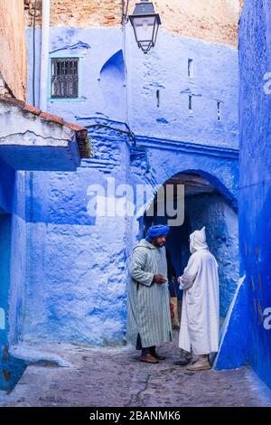 Two men in Chefchaouen, Morocco Stock Photo