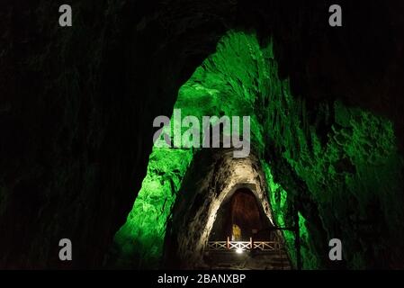 Nemocon, Cundinamarca / Colombia; March 24, 2018: mirror of water and walls illuminated with green lights inside a salt mine Stock Photo