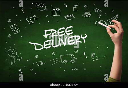 Hand drawing FREE DELIVERY inscription with white chalk on blackboard, online shopping concept Stock Photo