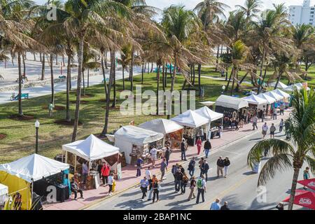 Miami Beach Florida,Ocean Drive,Art Deco Weekend,festival,fair,vendor vendors stall stalls booth market marketplace,Lummus Park,FL110116062 Stock Photo