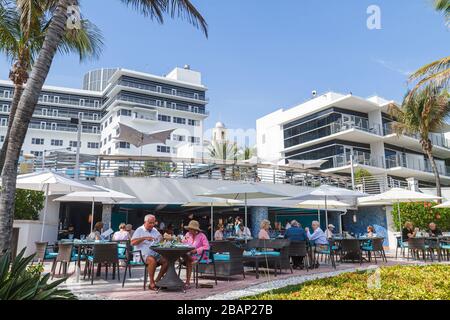 Miami Beach Florida,Ritz Carlton,hotel,al fresco sidewalk outside tables,dining,restaurant restaurants food dining cafe cafes,view from Beach Walk,FL1 Stock Photo