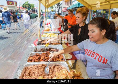 Miami Florida,Little Havana,Calle Ocho Street Festival,Hispanic celebration,woman female women,cook,cooking,vendor vendors stall stalls booth market m