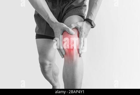 Joint pain, Arthritis and tendon problems. a man touching nee at pain point, on white background Stock Photo