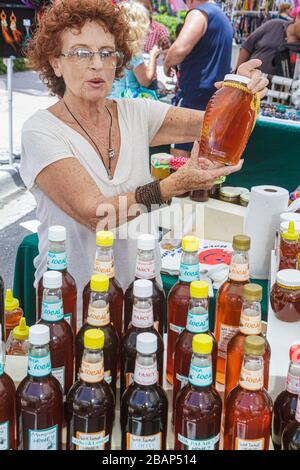 Miami Beach Florida,North Beach,Normandy Village selling,display case sale,vendor vendors,stall stalls booth market buyer buying selling,senior senior Stock Photo