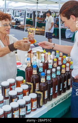 Miami Beach Florida,North Beach,Normandy Village selling,display case sale,vendor vendors,stall stalls booth market buying selling,senior seniors citi Stock Photo