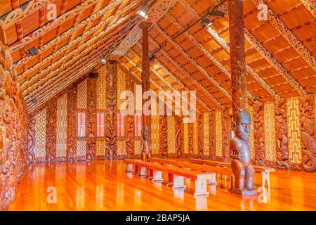 Traditional Maori carvings in the interior of Te Whare Runanga, the Maori Meeting House, in Waitangi, North Island, New Zealand. Stock Photo