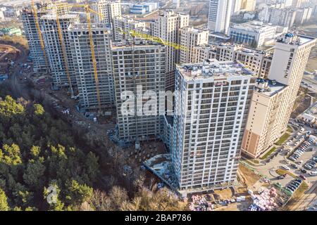 modern high-rise apartment buildings under construction. development of new residential area. aerial photo from flying drone Stock Photo