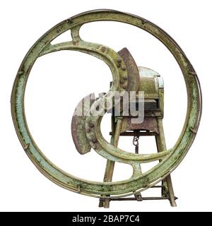 Green time machine concept. Metal w rusty heel and gears of vintage retro  farm mechanism  are covered with a rust and moss. Isolated on white Stock Photo