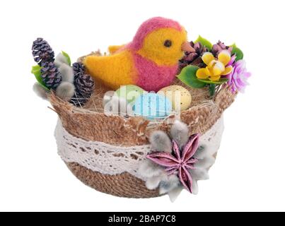 Easter handmade  nest from rope  and  funny  bird from  sheep wool by dry felting. Isolated on white studio macro shot Stock Photo