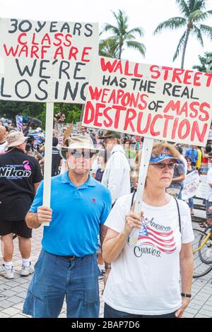 Miami Florida,Biscayne Boulevard,Freedom Torch,Occupy Miami,demonstration,protest,protesters,anti Wall Street,banks,corporate greed,sign,poster,messag Stock Photo