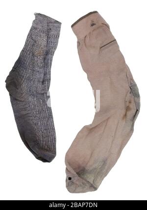 Yin and Yang, male and female concept- two old ragged smelly socks. Stock Photo