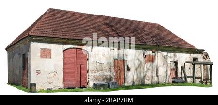 Long ruined brick village barn for farm tools and animals. Isolated on white Stock Photo