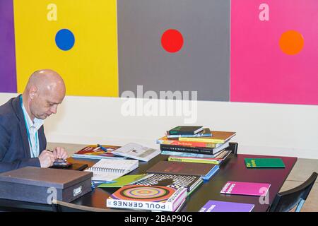 Miami Beach Florida,Miami Beach Convention Center,Centre,Art Basel,annual,fair,galleries,artwork,gallerist,dealer,man men male adult adults,bald,paint Stock Photo