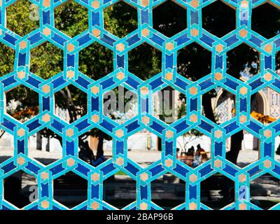 Arabesque hexagonal ornamented tiles pattern in blue and cyan colours. Common decorative form in muslim constructions in Uzbekistan, Central Asia Stock Photo