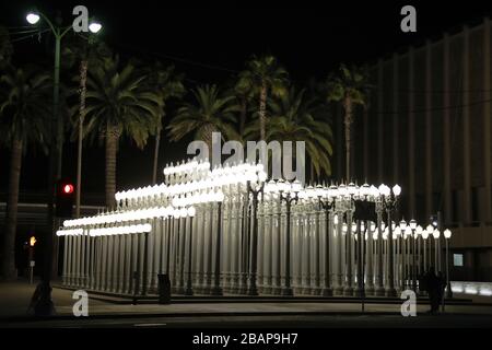 Los Angeles, USA. 28th Mar, 2020. An exterior view of the 'Urban Light' street lamps installation outside the Los Angeles County Museum of Art (LACMA) at 5905 Wilshire Blvd on March 28, 2020 in Miracle Mile, Los Angeles, California, United States. Urban Light is a large-scale assemblage sculpture by Chris Burden located at the Wilshire Boulevard entrance to the Los Angeles County Museum of Art. The 2008 installation consists of restored street lamps from the 1920s and 1930s. Most of them once lit the streets of Southern California. Los Angeles County Museum of Art (LACMA) Credit: Image Press A Stock Photo