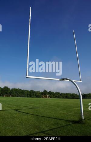 Football and soccer goals on sunny day Stock Photo