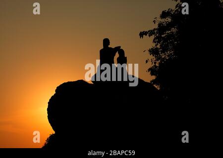 Jesus bless a man, statue silhouette Stock Photo