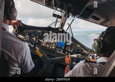 View of the flight deck while turning onto final approach in a DHC-6 Twin Otter at Princess Juliana International Airport, Sint Maarten Stock Photo