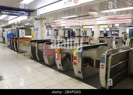 One of the busiest station in Tokyo was quiet after the governor's request that people stay at home the weekend to to prevent coronavirus infections. Stock Photo