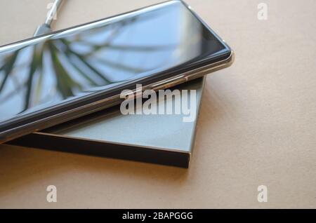 Smartphone wireless charging on induction charger. Wireless charger Stock Photo