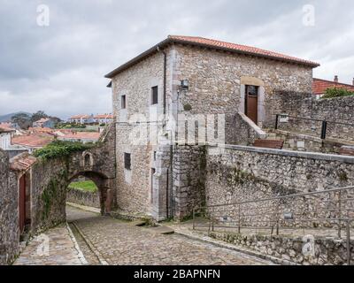 View of Torre del Preboste Tower and La Barrera or Santander City Gate, in San Vicente de la Barquera, Cantabria, Spain Stock Photo