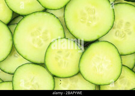 slices of fresh green cucumbers as a food background texture Stock Photo