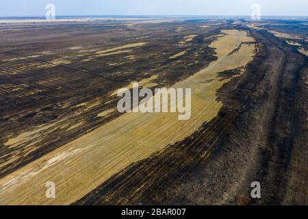 The consequences of natural fires in the steppes of the Astrakhan region, Russia. Stock Photo