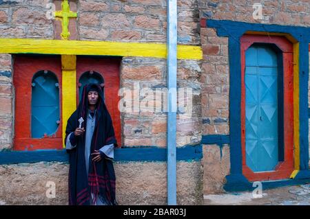 Priest monk at the Abuna Garima monastery Tigray. Abba Garima Monastery is an Ethiopian Orthodox monastery, located around five kilometres east of Adw Stock Photo