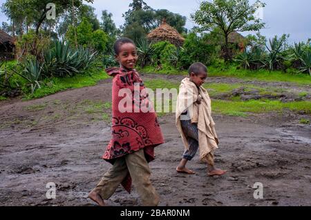 Children and traditional african village house in Lalibela village in Amhara region, Northern Ethiopia Stock Photo