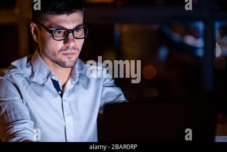 Guy At Laptop Working Coding Website Overnight Sitting Indoor Stock Photo