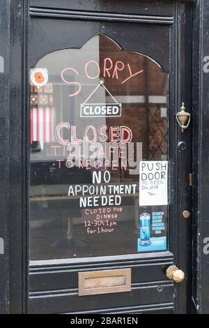 The local barber's shop in the small town of Presteigne, Powys, Wales, UK - another small business closed during the coronavirus outbreak Stock Photo