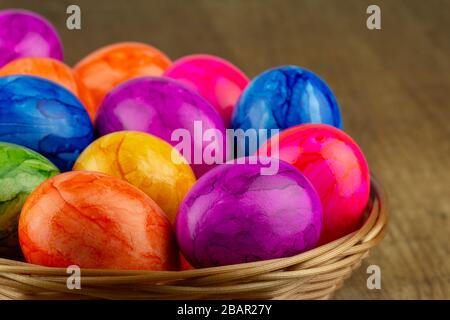colorful easter eggs in an easter basket closeup Stock Photo