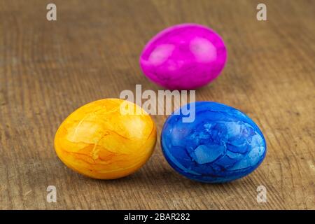 colorful easter eggs on a wooden board Stock Photo