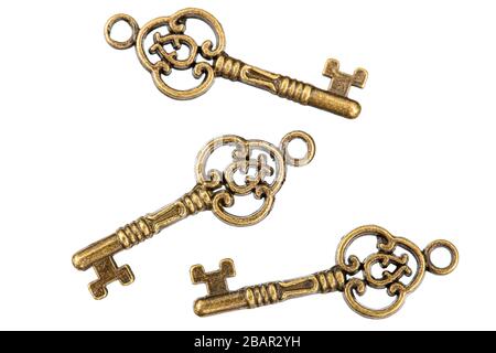 Set of bronze keys, decorative element for design, isolated on white background Stock Photo