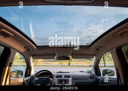 Inside detailed photo of wonderful SUV with panoramic glazed dach/sunroof